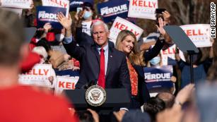 Vice President Mike Pence and Georgia Sen. Kelly Loeffler wave to the crowd during a Defend the Majority Rally, in Canton, Georgia, on Nov. 20, 2020.