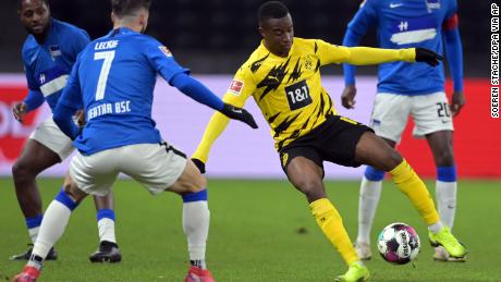 Moukoko turns with the ball against Hertha Berlin. 