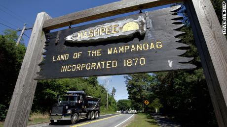A wooden sign advises motorists of the location of Mashpee Wampanoag Tribal lands in Massachusetts. 