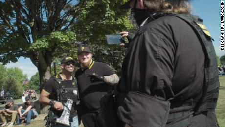 Proud Boys President Enrique Tarrio is posing with a Proud Boys member at a demonstration in Delta Park, Portland, Oregon, on September 26, 2020. 