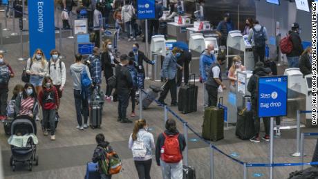 US air travel sets a pandemic-era record despite calls to stay home for Thanksgiving