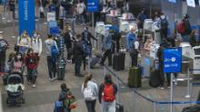 US air travel sets a pandemic-era record despite calls to stay home for Thanksgiving