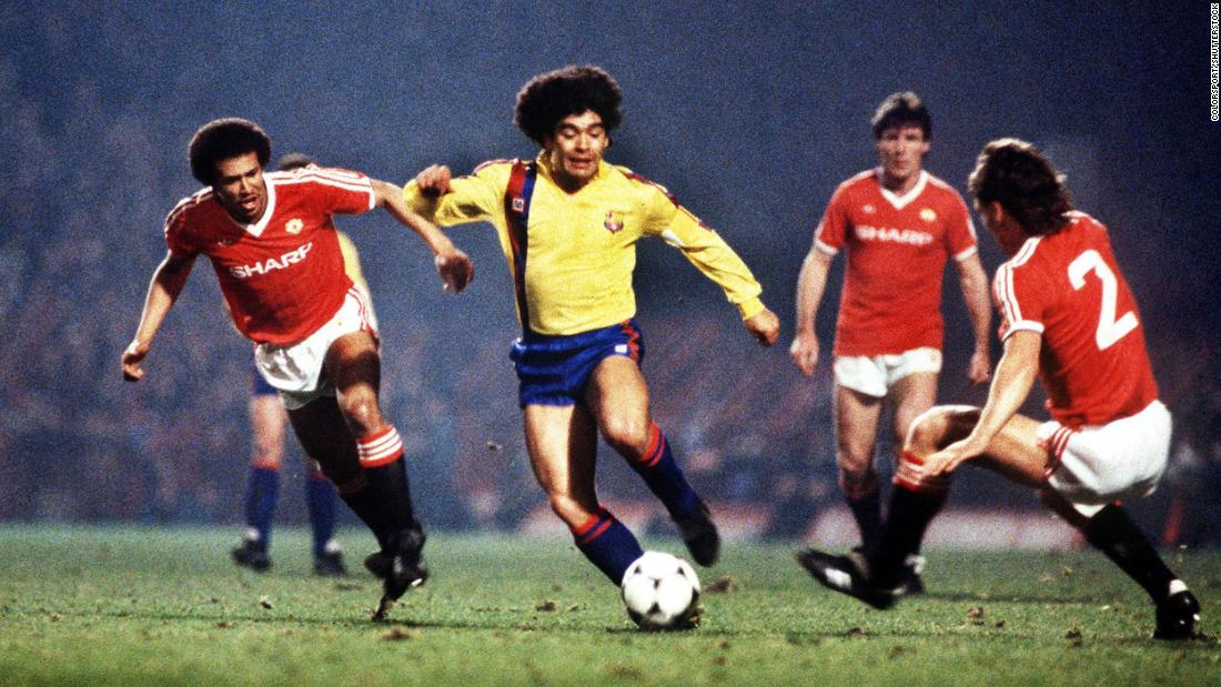 Maradona, playing for Barcelona, dribbles past Manchester United players in 1984.