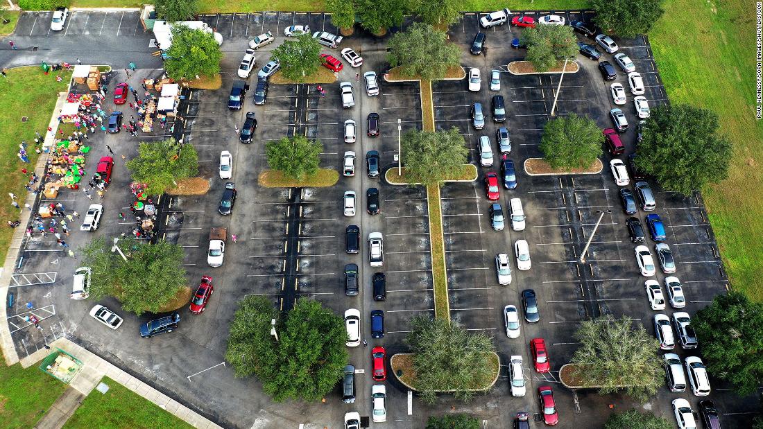 Vehicles line up for food distribution in Clermont, Florida, on November 21.