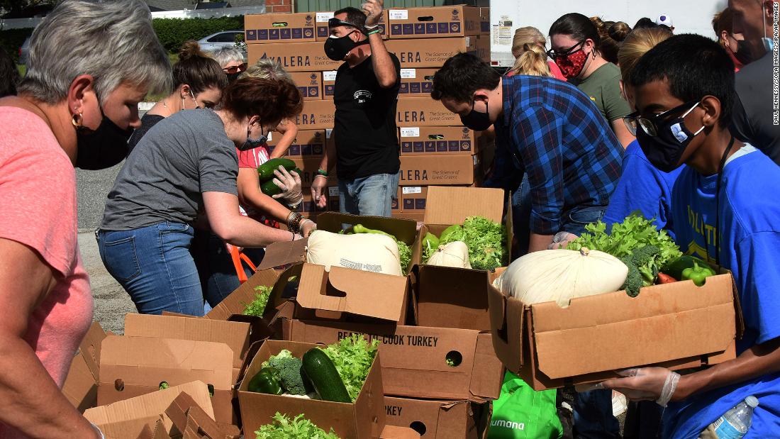 Volunteers distribute turkeys and other foods in Clermont, Florida.