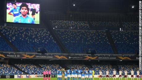 Players and officials observe a minute&#39;s silence in memory of Maradona.
