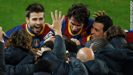 &#39;Una Manita&#39; emerges from Barcelona&#39;s celebrations after their fifth goal against Real Madrid on November 29 2010. 