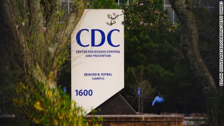 A security guard walks on the grounds of the Centers for Disease Control and Prevention (CDC) headquarters in Atlanta, Georgia, U.S, on Saturday, March 14, 2020. As the novel coronavirus has spread in the U.S., the CDC is under increasing heat to defend a shaky rollout of crucial testing kits. Photographer: Elijah Nouvelage/Bloomberg via Getty Images