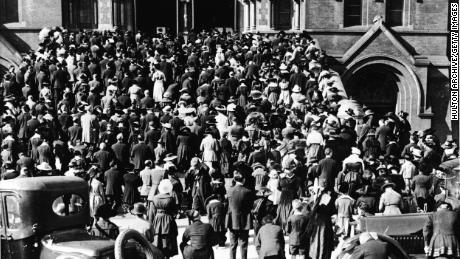San Francisco: The congregation of the Cathedral of Saint Mary of the Assumption praying on the steps, where they gathered to hear mass and pray during the influenza pandemic of 1918.