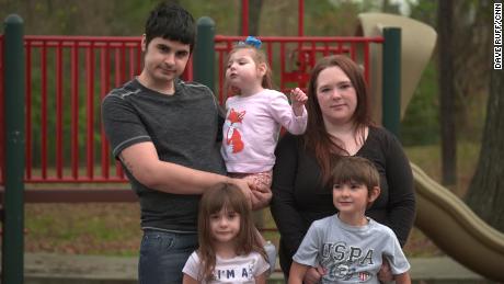 Jessica Lusk and Dylan Garcia stand with their children Brandi (3), Isabella (5), and Elijah (6).