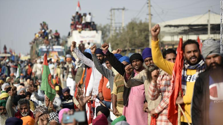 Tens of thousands of farmers swarm India’s capital to protest deregulation rules