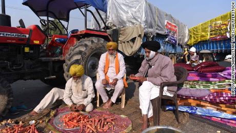 Farmers are preparing food on the fifth day of the protest against agricultural reform laws in Singhu border, November 30, 2020, in New Delhi, India. 