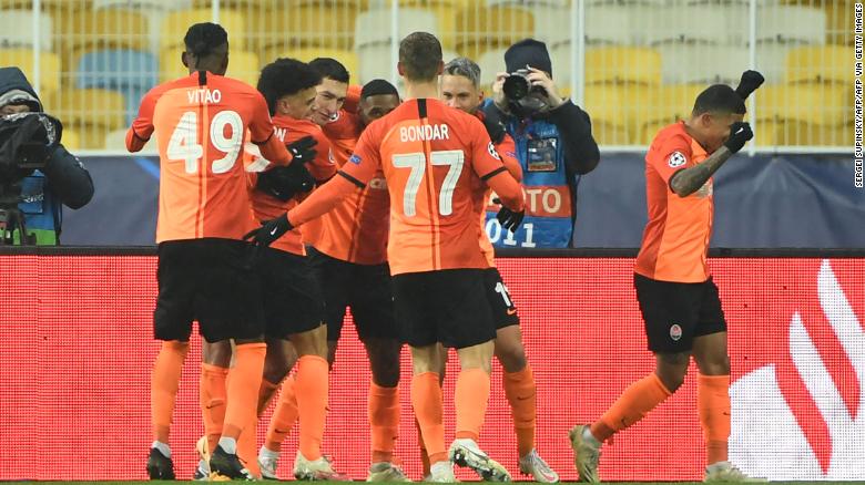 Dentinho celebrates with his teammates after scoring against Real Madrid. 