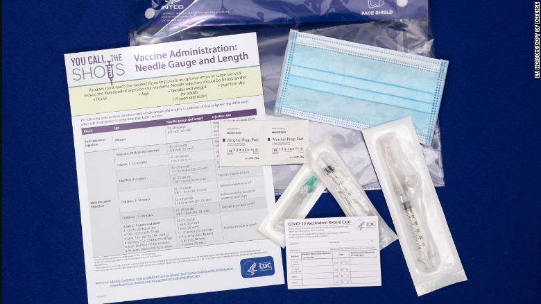 A display shows items that will be provided with Covid-19 vaccines at Operation Warp Speed headquarters in Washington, DC, on November 13.