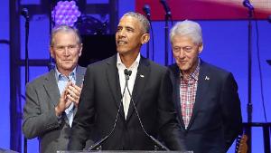 Former United States Presidents George W. Bush, Barack Obama and Bill Clinton address the audience during the &quot;Deep From The Heart: One America Appeal Concert&quot; at Reed Arena in this October 21, 2017 file photo in College Station, Texas.