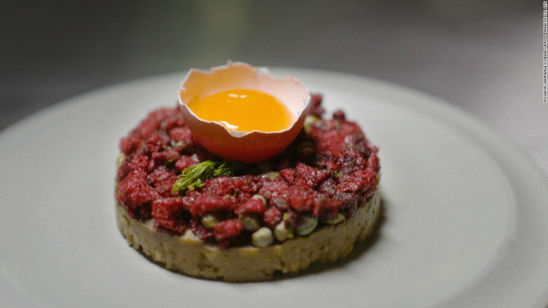 Design student Sorawut Kittibanthorn has created an alternative protein using chicken feathers. He showcases them in high-end gourmet dishes, like this &quot;beef&quot; tartare with smashed avocado, raw egg yolk, red onion, parsley, dill, chili flakes and capers. 