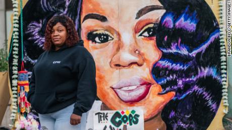 Tamika Palmer, mother of Breonna Taylor, poses for a portrait in front of a mural of her daughter at Jefferson Square park on September 21, 2020 in Louisville, Kentucky.