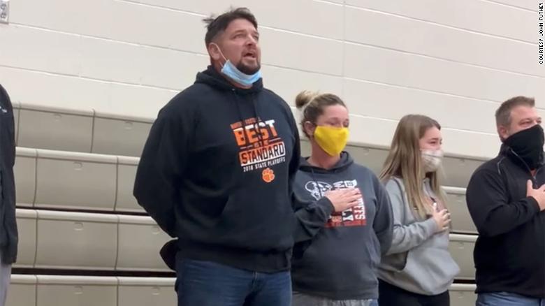 Dad sings impromptu National Anthem at high school basketball game after sound system fails