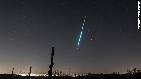 A Geminid shooting star streaks across the sky in December 2017. 