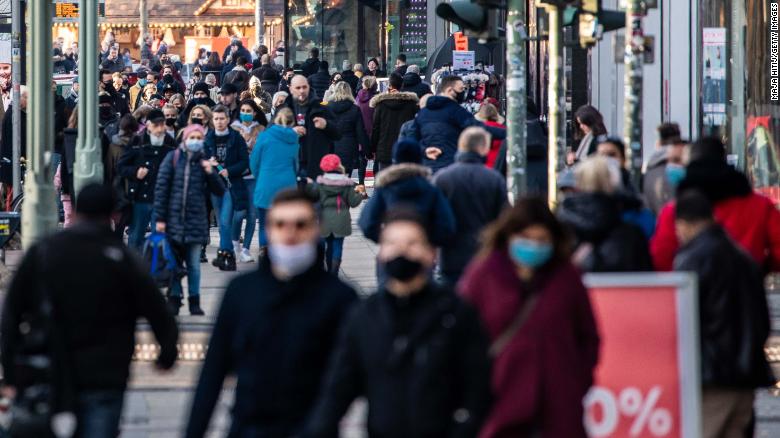 Shoppers walk past Kurfürstendamm avenue in Berlin on December 6.