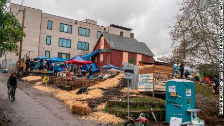 Protesters build defensive structures around the Red House in Mississippi in Portland, Oregon on December 9, 2020. 