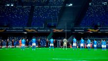 Players hold a minute's silence for late Italian football legend Paolo Rossi.