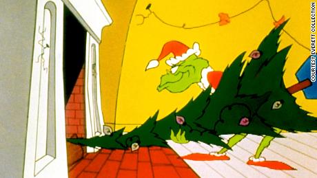 The Grinch sends a tree up the chimney during his raid on Whoville in the 1966 cartoon classic, &quot;How the Grinch Stole Christmas.&quot;