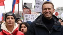 Alexey Navalny and his wife, Yulia, march in memory of slain Kremlin critic Boris Nemtsov in Moscow in 2019. Yulia became ill during a vacation in Kaliningrad.