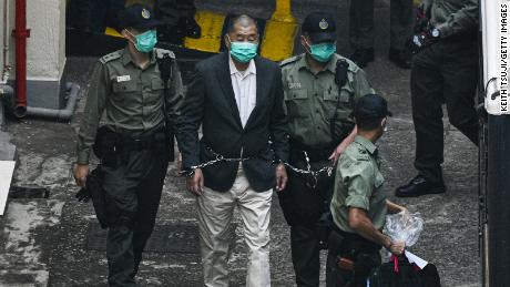 Hong Kong media tycoon Jimmy Lai, founder and owner of Apple Daily newspaper is seen handcuffed and escorted by the guards leaving Lai Chi Kok Reception Centre on December 12, 2020, in Hong Kong, China.  