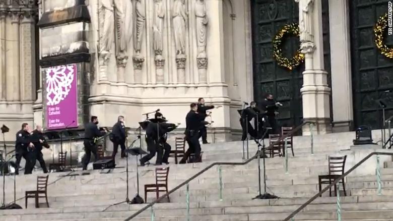 A gunman is dead after a shooting at a New York City cathedral Christmas concert