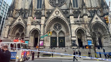 A gunner opened fire in front of the church before police fired.