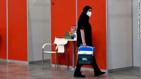 A worker in the Bahraini capital Manama&#39;s convention centre, which was repurposed for Sinopharm vaccine trials, on August 27.