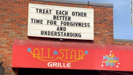 A message of encouragement is displayed above the bowling alley's restaurant.
