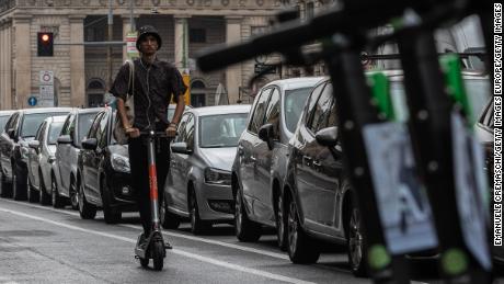 MILAN, ITALY - SEPTEMBER 23: A man rides an electric scooter on a pop-up bike lane on Corso Buenos Aires on September 23, 2020 in Milan, Italy. Since the end of lockdown Milan authorities have added a further 35 kilometers of pop-up bike lanes and cycle paths and encouraged cycling and riding e-scooters as a safer form of transport away from jam-packed buses or subway trains, in order to promote social distancing in response to COVID-19. (Photo by Emanuele Cremaschi/Getty Images)