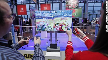 Visitors play Arms on the Nintendo Switch console during its German premiere in Offenbach, Germany, January 13, 2017.