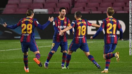 Jordi Alba celebrates with Messi after scoring Barcelona&#39;s opening goal.