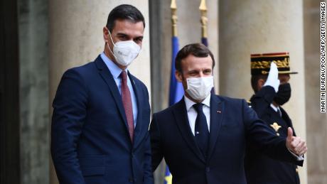Macron at the Elysee on Tuesday with Spanish Prime Minister Pedro Sanchez, who is also quarantining as a precaution.