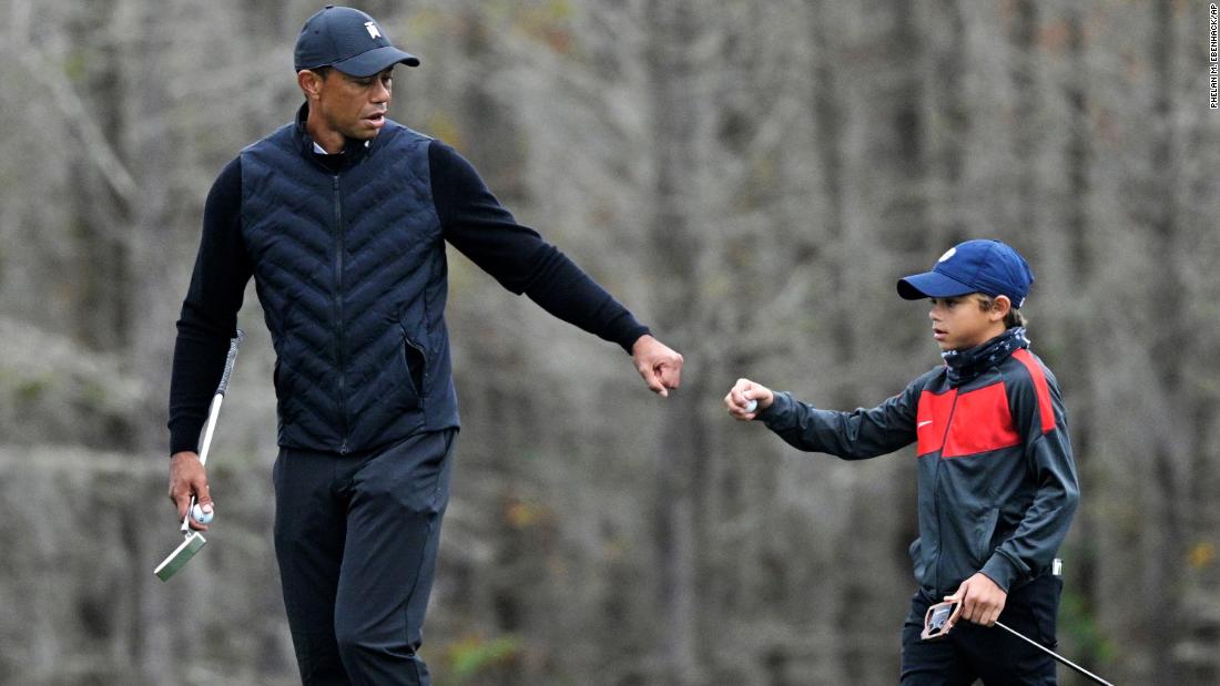 Tiger Woods warms up with his 11-year-old son Charlie, and the similarities are striking