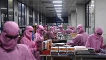 Workers pack syringes at the Hindustan Syringes factory, India&#39;s biggest syringe manufacturer, is ramping up production to churn out a billion units, anticipating a surge in demand.