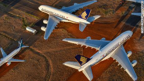 ALICE SPRINGS, AUSTRALIA - MAY 15: Grounded aeroplanes which include Airbus A380s, Boeing MAX 8s and other smaller aircrafts are seen at the Asia Pacific Aircraft Storage facility on May 15, 2020 in Alice Springs, Australia. The number of passenger planes housed at the Asia Pacific Aircraft Storage facility has increased due to the Coronavirus (COVID-19) pandemic with at least four Airbus A380 planes grounded there, the first time the aircraft has landed at Alice Springs. (Photo by Steve Strike/Getty Images)