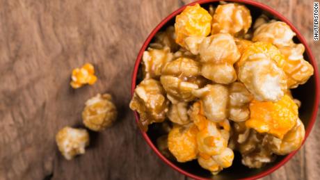Christmas movie watching is incomplete without hot caramel popcorn for snacking.

