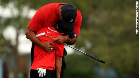 Tiger Woods hugs his son Charlie  on the 18th hole after the final round of the PNC Championship.