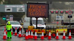 A sign alerts customers that the &quot;French Borders are Closed&quot; at the entrance to the Port of Dover in Kent, south east England on December 21, 2020, as a string of countries banned travellers all but unaccompanied freight arriving from the UK, due to the rapid spread of a more-infectious new coronavirus strain. - Britain&#39;s critical south coast port at Dover said on Sunday it was closing to all accompanied freight and passengers due to the French border restrictions &quot;until further notice&quot;. (Photo by William EDWARDS / AFP) (Photo by WILLIAM EDWARDS/AFP via Getty Images)