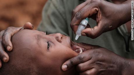 A boy receives drops of polio vaccine in Kajiado, Kenya, in 2018.