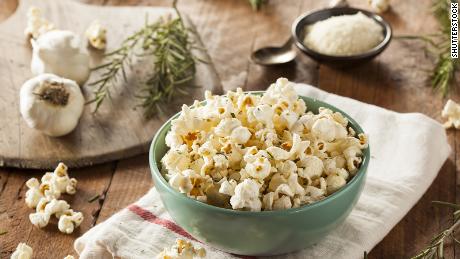 To accompany holiday movie watching, a bowl of hot popcorn with freshly grated Parmesan is just the ticket.