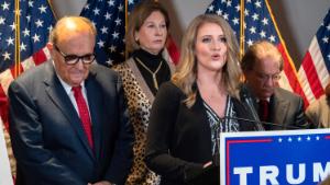 Members of President Donald Trump&#39;s legal team, including former Mayor of New York Rudy Giuliani, left, Sidney Powell, and Jenna Ellis, speaking, attend a news conference at the Republican National Committee headquarters, November 19, 2020, in Washington. 