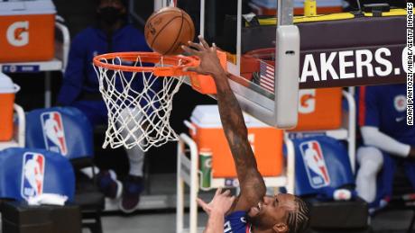 Kawhi Leonard dunks the ball against the Lakers.