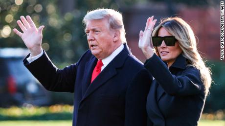 WASHINGTON, DC - DECEMBER 23: President Donald Trump and first lady Melania Trump walk on the south lawn of the White House on December 23, 2020 in Washington, DC. The Trumps are headed to Mar-a-Lago for the holidays with a government shutdown possible on Monday December 28. (Photo by Tasos Katopodis/Getty Images)