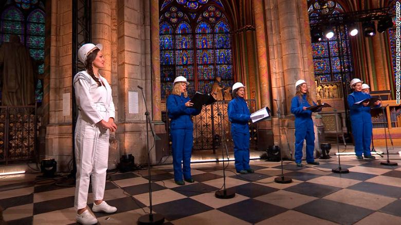 With choir in hard hats, fire-ravaged Notre Dame rings in Christmas