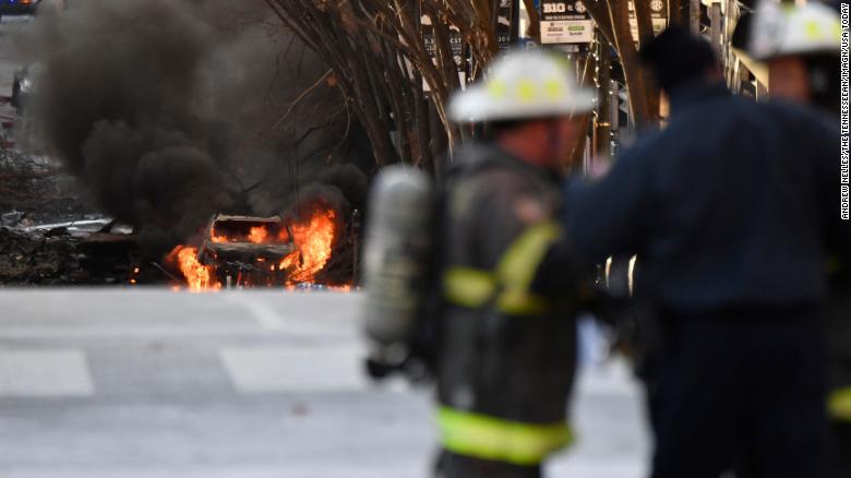 A vehicle burns following an explosion in downtown Nashville on Friday, December 25. 